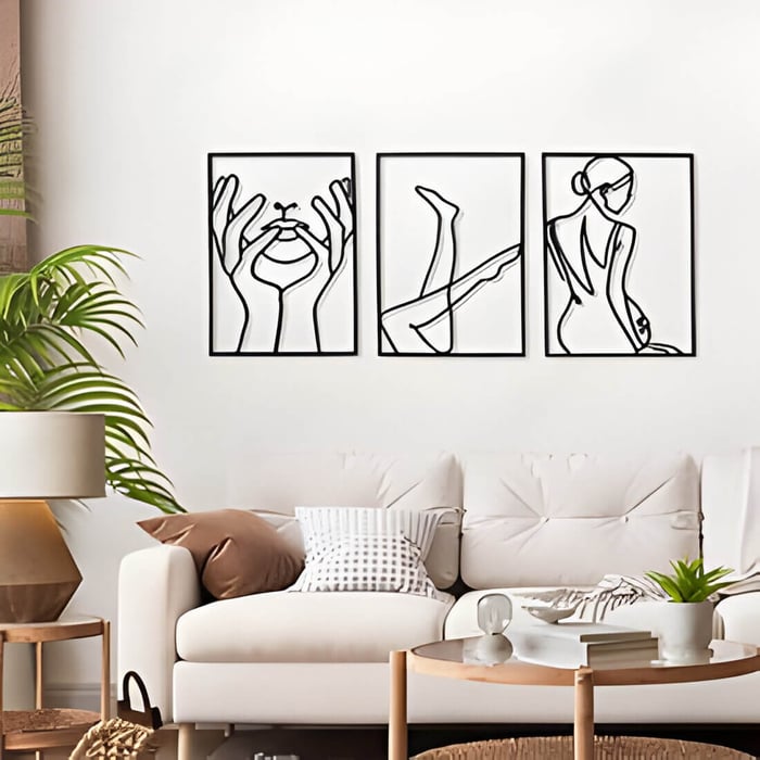 a minimal style living room with black abstract wall art