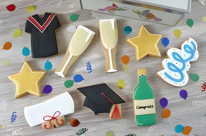 A selection of multicoloured, graduation themed biscuits