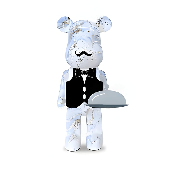 a white and pale blue giant bear sculpture in a waiters outfit