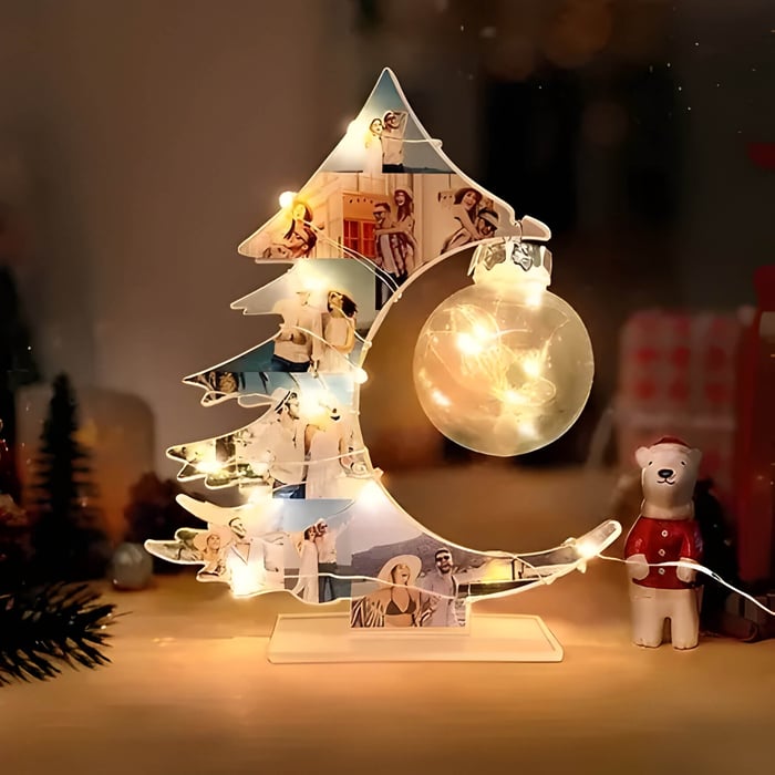 A Christmas night light with a lit bulb