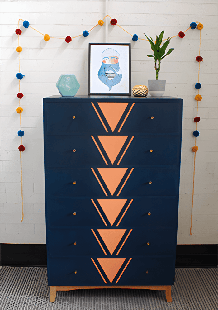 a painted blue and rose gold storage unit