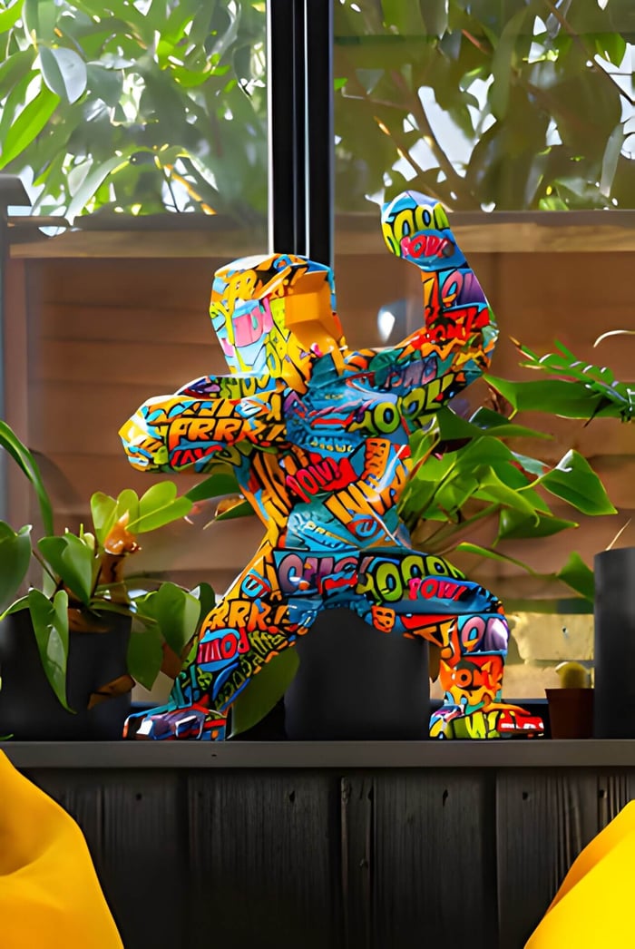 A pop art giant bear gorilla sculpture in a modern home next to plants