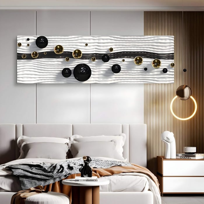 A modern bedroom features the Lustra Black & White 3D Wood Relief Wall Art With Metal Ball from Giant Sculptures above the bed, showcasing metallic spheres on a textured background. The room also includes a neatly made bed, a bedside table, and a uniquely designed circular light fixture.