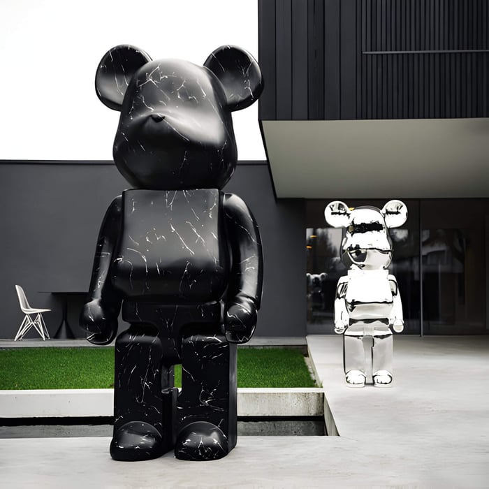 Giant Bears 165cm sculpture and chrome 135cm bear sculpture next to luxury modern home garden