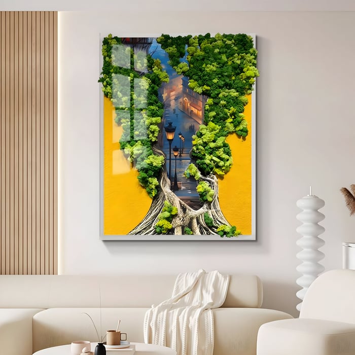 Framed 3D wall art featuring a vibrant golden yellow backdrop with textured tree roots and lush green moss forming a silhouette that reveals a city street scene with lampposts and buildings.