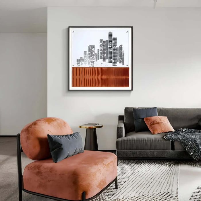 Stylish living room featuring a framed city skyline artwork with an orange textured base above a dark sofa and a rust-coloured accent chair.