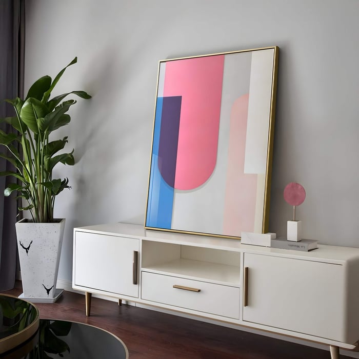 Bounce Pink & Blue Panel Acrylic 3D Wall Art with geometric abstract design in gold frame, displayed on a modern white sideboard in contemporary living room.