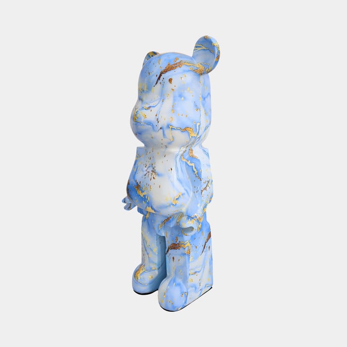 a blue white and gold giant bear sculpture