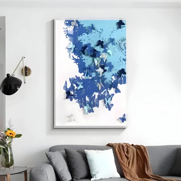 A contemporary living space featuring a large 3D wall art piece with layered blue butterflies against a gradient background, adding depth and movement to the decor.