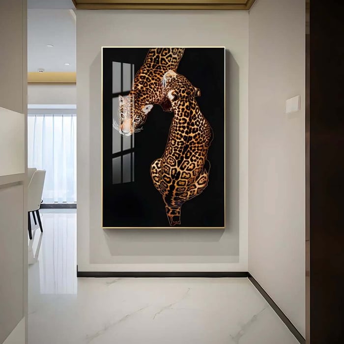 Tall framed leopard artwork on a hallway wall with bright, modern interior lighting and glossy flooring.