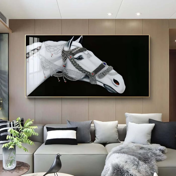 Large framed horse portrait above a sofa in a contemporary lounge with neutral cushions and soft lighting.