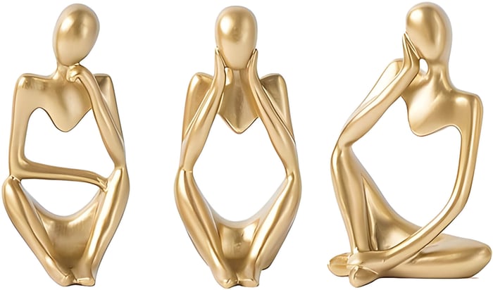 3 abstract golden sculptures of people thinking
