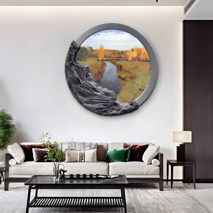 A modern living room features the Sylvara Golden River Hand-Painted Wood Relief 3D Wall Art by Giant Sculptures above a white sofa with colorful cushions. It has high ceilings, a dark wood accent wall, a metal and glass coffee table, and a corner plant that reflects the serene river flow.