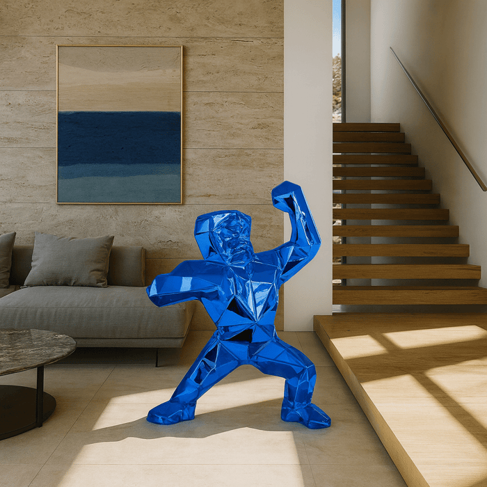 Sapphire Blue Gorilla Sculpture – 135cm displayed in a modern living room, a bold geometric design with faceted details creating a striking artistic centrepiece.
