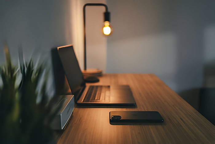 a modern minimal desk with a lamp