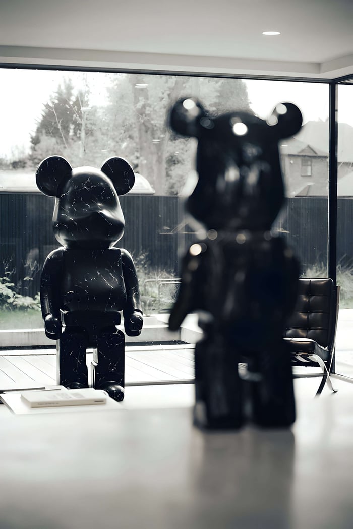 2 giant bear sculptures facing each other inside a house