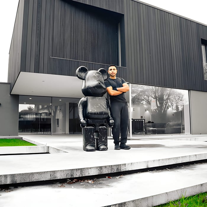 Gino with a Black Stone Giant Bear Sculpture