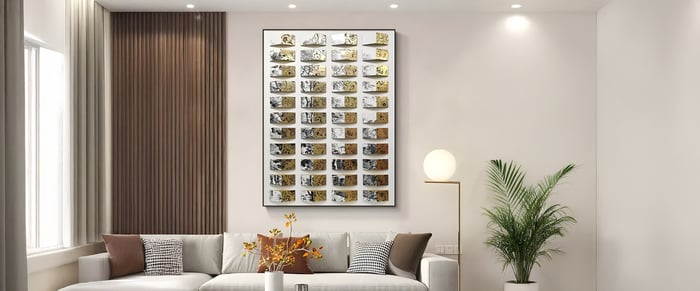 3D wooden wall art with gold and black patterned pieces arranged in a grid, adding depth and elegance to a cozy living room featuring neutral furniture and modern accents.