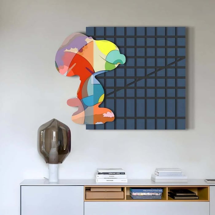 Colourful abstract profile artwork over a dark blue grid canvas displayed above a modern sideboard.