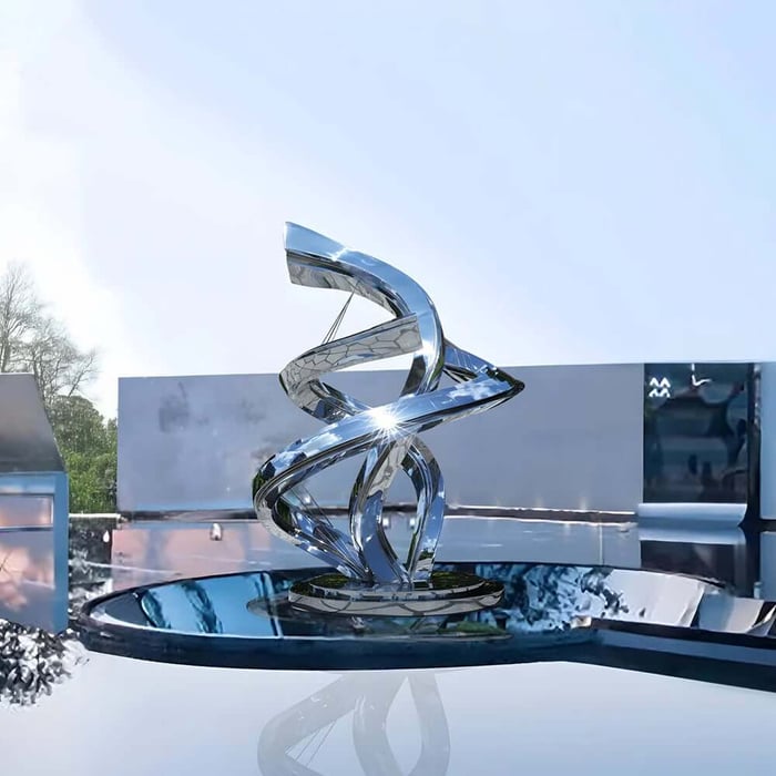 Reflective stainless steel spiral abstract sculpture centered on a round water basin in a contemporary outdoor space.