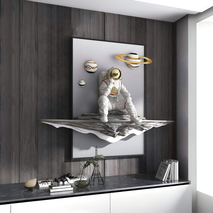 Futuristic astronaut 3D wall piece with floating planets, set on dark wood paneling above a modern black and white console.
