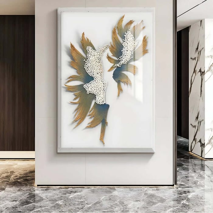 Large framed abstract wall art with white pebble clusters and gold-blue, feather-like forms, displayed in a modern marble-floored hallway.
