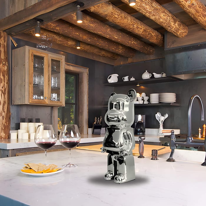 A chrome giant bear sculpture inside a rustic cabin style interior design