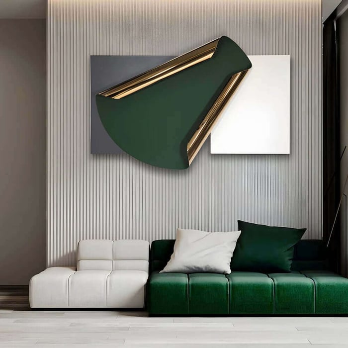 Modern living room with a white and green modular sofa beneath a large abstract green and gold iron wall sculpture mounted on layered grey and white panels.