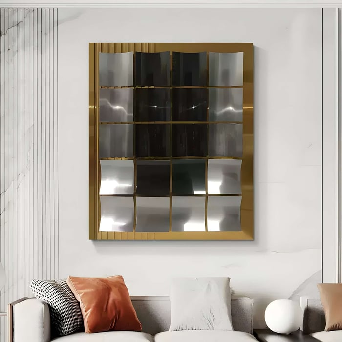 Distorted Mirror Wall Art with Gold Frame – A contemporary wall mirror with a gold frame, featuring a grid of wavy, distorted mirrored panels that create a dynamic reflection. Displayed in a luxurious, neutral-toned living area with modern furnishings.