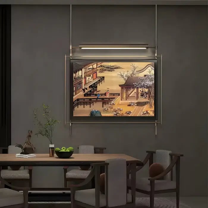 A refined dining space with a traditional Asian-inspired painting framed in black and gold, with warm ambient lighting creating an inviting atmosphere.