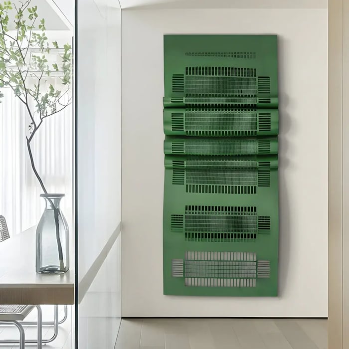 A modern interior featuring a striking vertical wall sculpture with a layered metallic green design, adding a bold artistic element to the space.