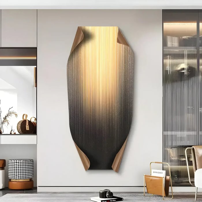  A luxurious interior with a vertical abstract artwork in shades of gold and black, featuring a unique curled design for added depth and dimension.