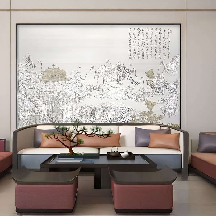Elegant Asian landscape mural with calligraphy behind a low modern sofa and bonsai.