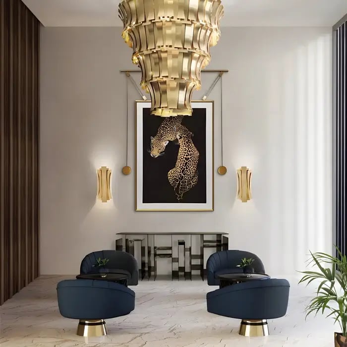 A high-end lounge area featuring a framed leopard-themed artwork, complemented by gold accents, plush navy chairs, and an opulent chandelier.