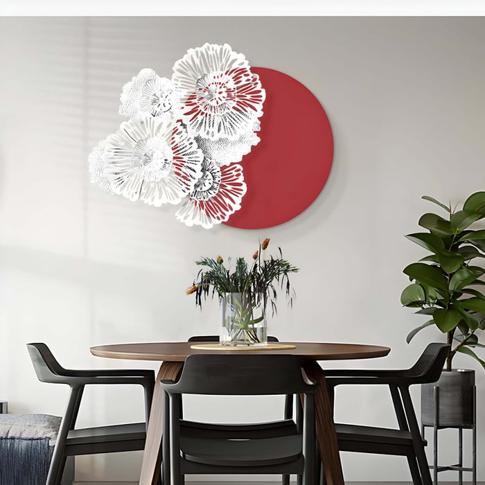 Decorative floral iron art layered over a red circle in a cozy dining space.
