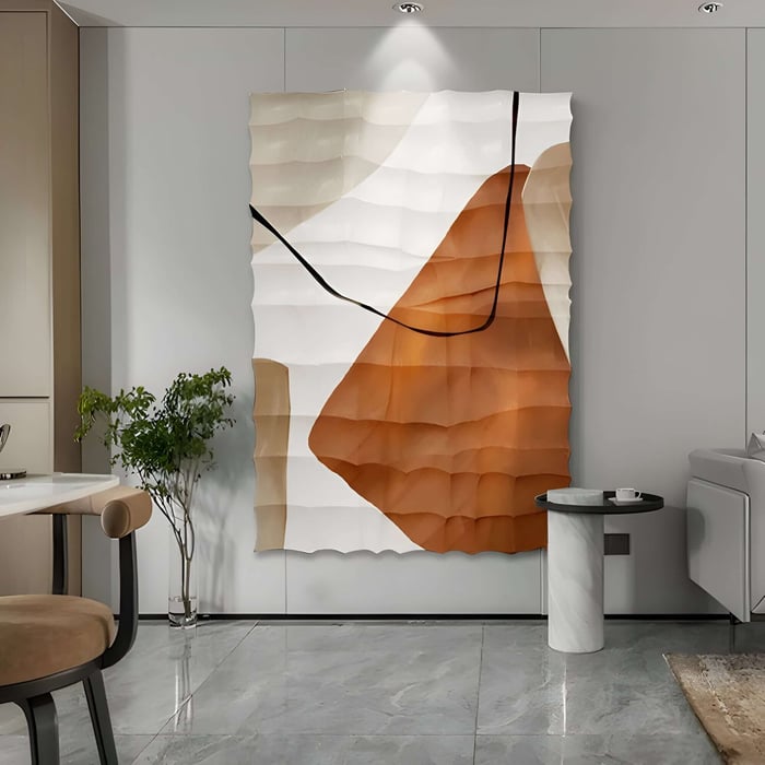 Oversized abstract leather wall sculpture with cream and terracotta shapes and softly rippled surface.