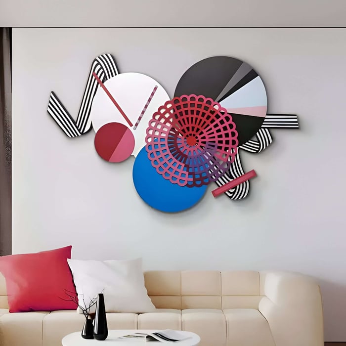 Bold geometric leather wall art with layered circles, stripes and colourful graphic shapes above a sofa.