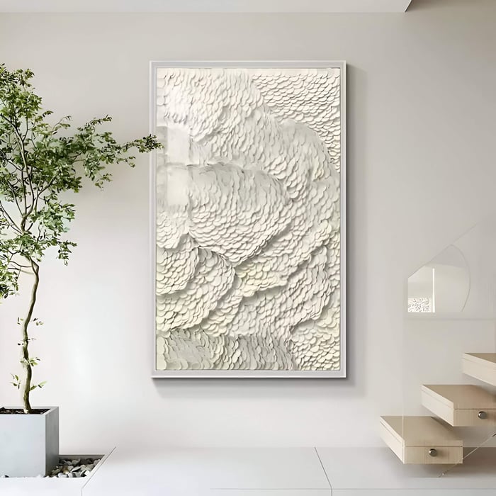 Tall vertical white leather wall panel with layered scale-like texture beside a staircase.