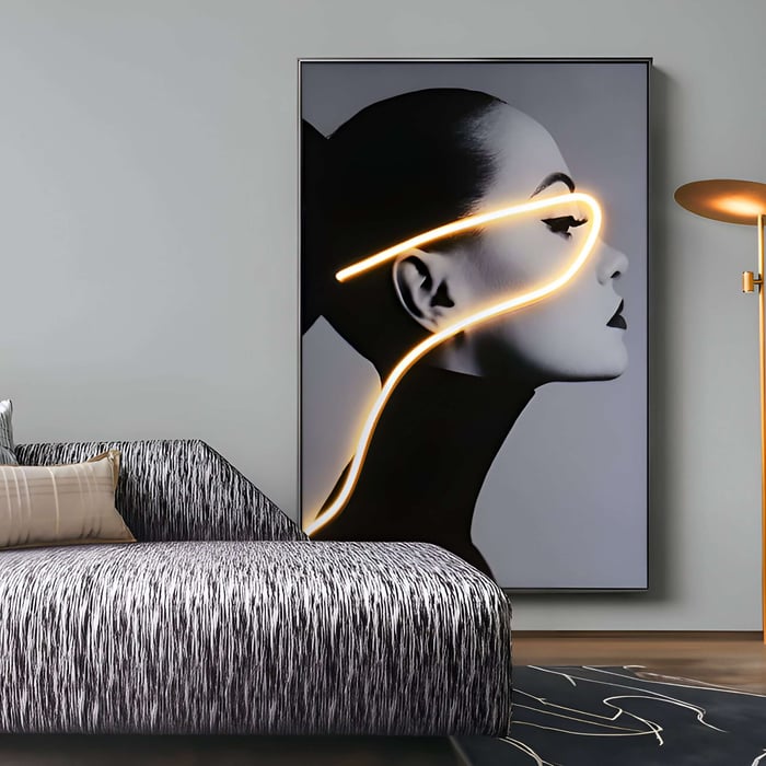 Monochrome portrait of a woman with glowing neon line accent in a stylish room.