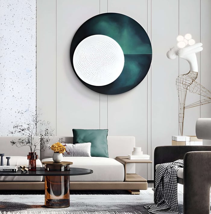 Sophisticated interior with a large round green and white textured artwork above a stylish seating area.