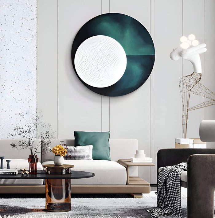  A luxurious interior with a round green and white gradient wall art piece, accompanied by a sculptural lamp and elegant furnishings.