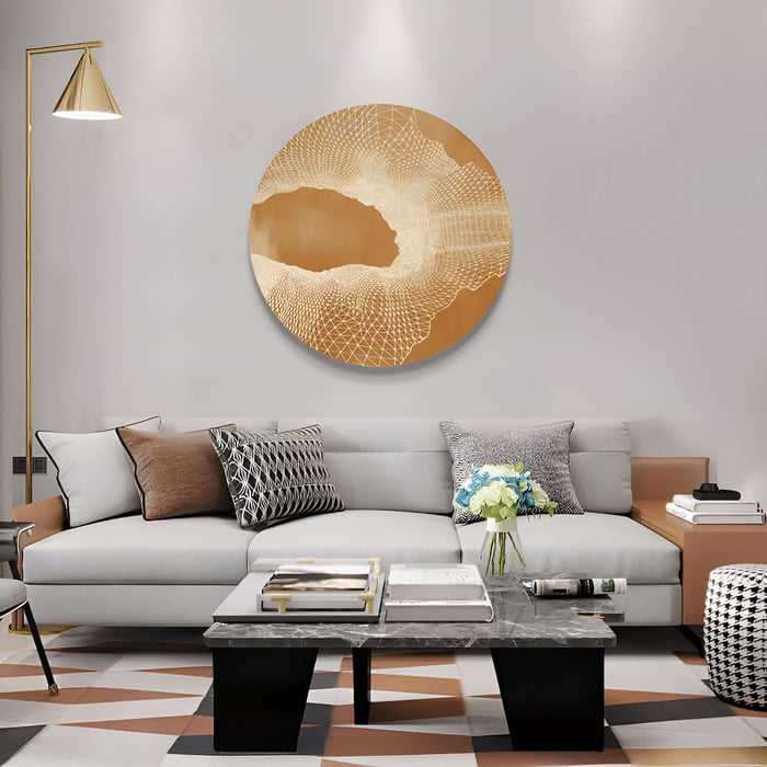Elegant sitting area with a gold circular abstract artwork complementing warm-toned décor.
