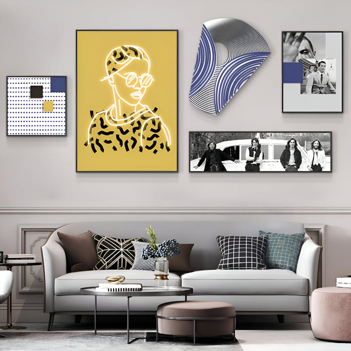 Eclectic living room gallery wall with neon pop art, abstract patterns, and black-and-white band photo.