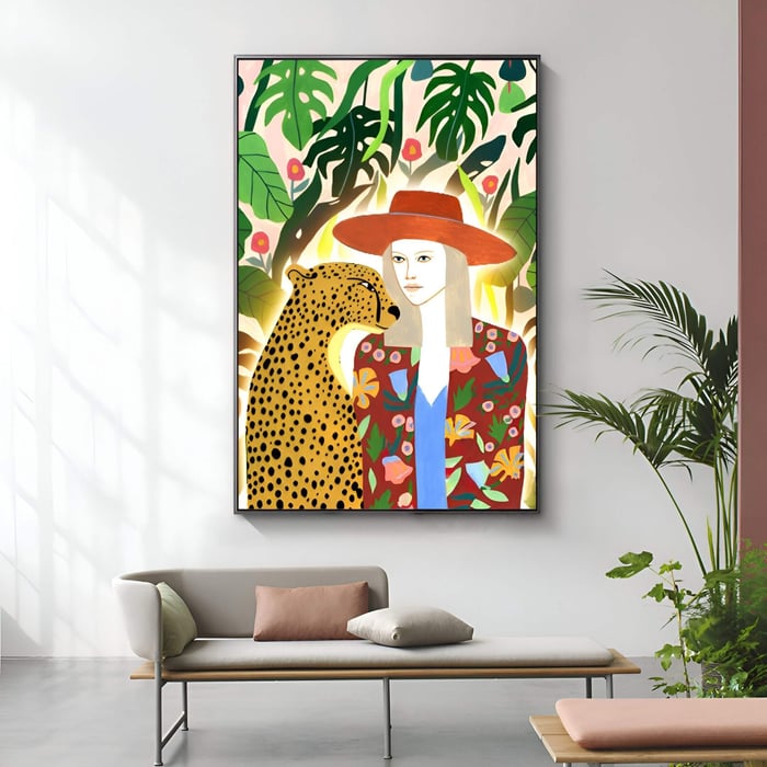 Colorful painting of a woman and a cheetah in a tropical setting, displayed above a minimalist bench with soft cushions.