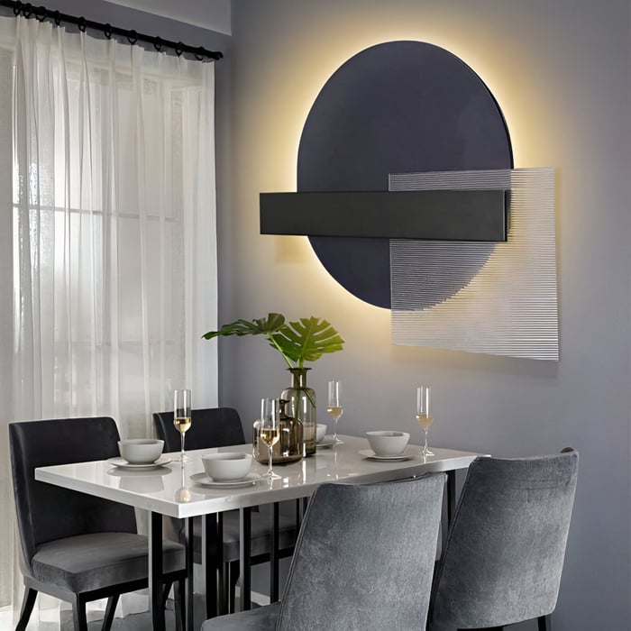 Geometric Circle Light Art – Dining room with glowing wall sculpture of overlapping black, white & round shapes.