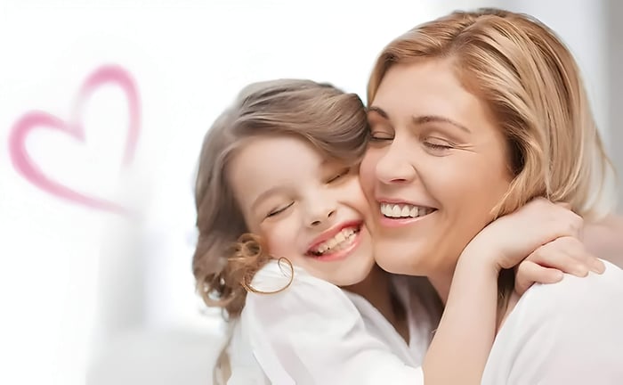 a mother and daughter hugging