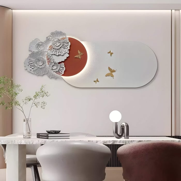 Contemporary dining room with butterfly-themed organic art featuring metallic florals and a soft red sunburst accent.