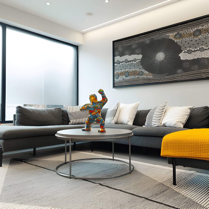 A multi coloured gorilla sculpture in a modern living room