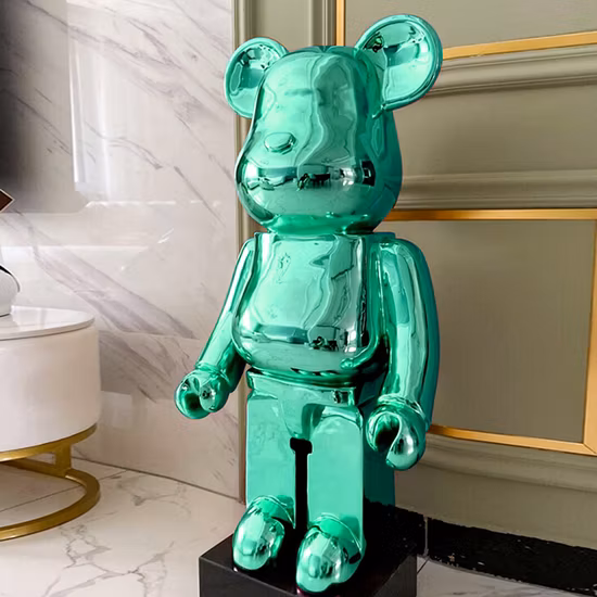 Contemporary resin sculpture with a marble-look finish on a pedestal, styled in a modern interior.