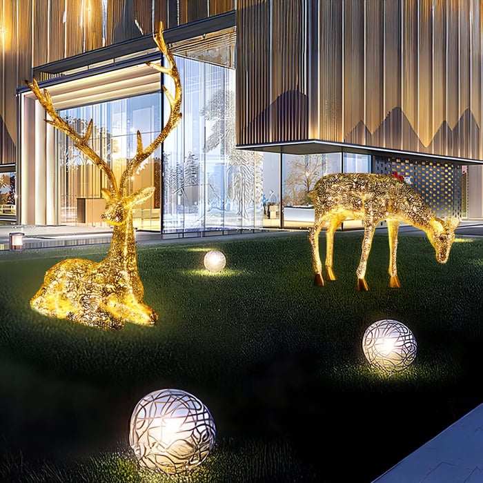 Two Deer animal sculptures enhancing visual by lighting in garden